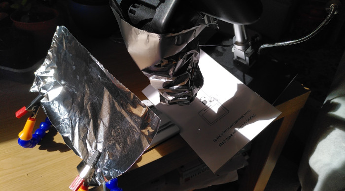 A microscope is used to enlarge the projection of the eclipse